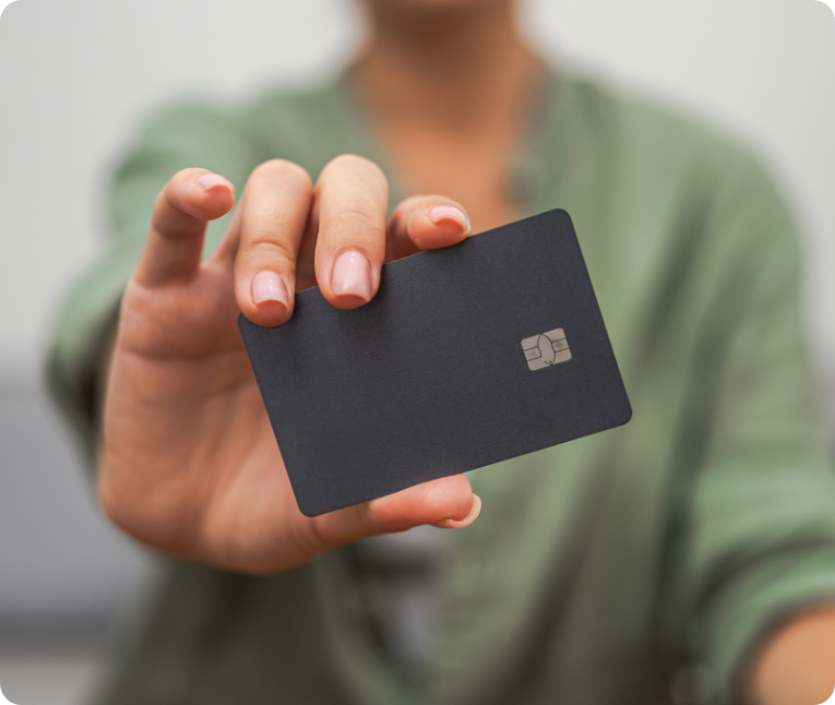 A person showing a black bank card